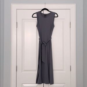 Bluish-grey column dress with belted waist.